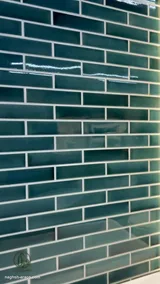 Backlit green subway tile wall behind a bathtub (3)