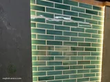 Backlit green subway tile wall behind a bathtub (4)